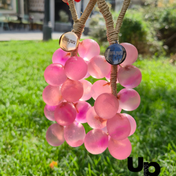 Transparentno roze sapun u obliku grožđa sa cvetovima